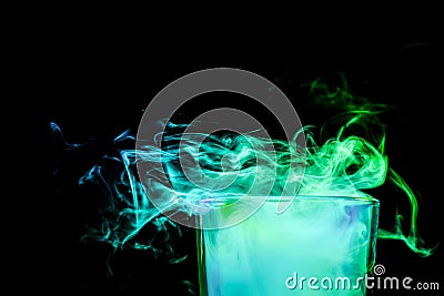 A glass with colorful smoke Stock Photo