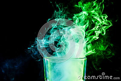 A glass with colorful smoke Stock Photo