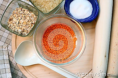 Glass container with lentils . Kitchen utensils. Lentils, oatmeal, rice and sugar Stock Photo