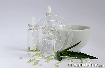 Essential oil for beauty. Cosmetic ingredients and aloe stand on a light background Stock Photo