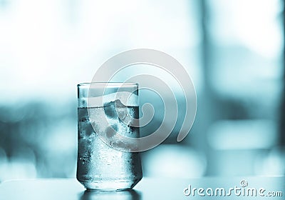 Glass of Cool fresh drink with ice cube on the table Stock Photo