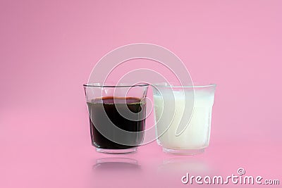 Glass of cool fresh milk, black coffee with reflection on pink background. Beverage in morning concept Stock Photo