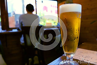 A glass of craft beers in vintage cafe Stock Photo