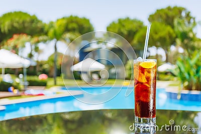 Glass of cuba libre cocktail on the glass table Stock Photo