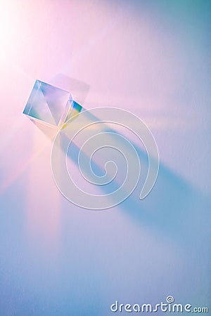 Glass cube with color spectrum rays. Abstract background with reflection and refraction of light. Shadow and rays of natural light Stock Photo