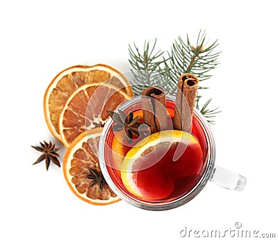 Glass cup of mulled wine, dried orange and fir branch on white background Stock Photo