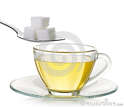 Glass cup of tea and sugar isolated on white background Stock Photo