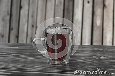 Glass cup with tea on a wooden table Stock Photo