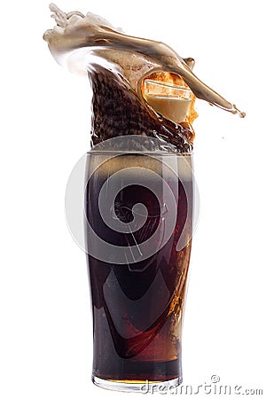 Glass of dark beer on a white background, splash Stock Photo