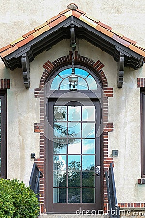 Glass door and transom reflecting the sky Stock Photo