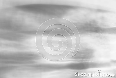 Glass drops diagonal shadow and light caustic effect on a white wall. Caustics formed by the refraction of the sun in a bottle on Stock Photo