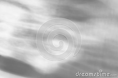 Glass drops diagonal shadow and light caustic effect on a white wall. Caustics formed by the refraction of the sun in a bottle on Stock Photo