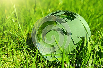 Glass earth on gras Stock Photo