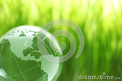 Glass earth in grass Stock Photo