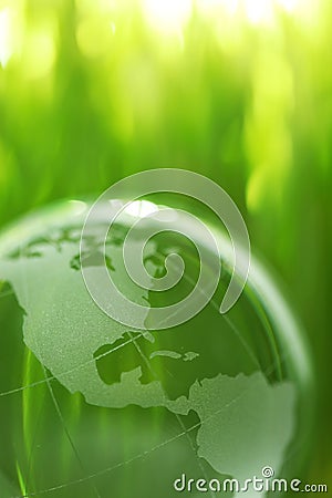 Glass earth in grass Stock Photo
