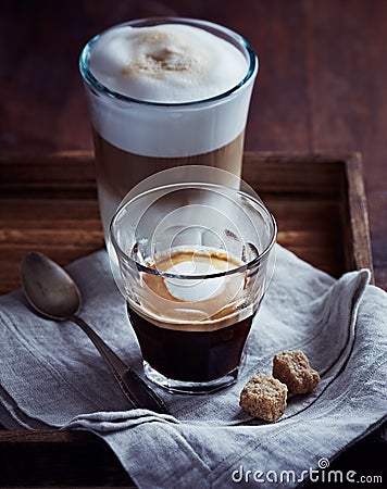 Glass of Espresso Macchiato and Latte Macchiato on a Tray Stock Photo