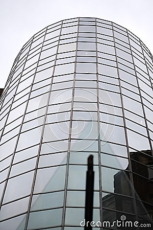 Glass facade of a round modern building Stock Photo