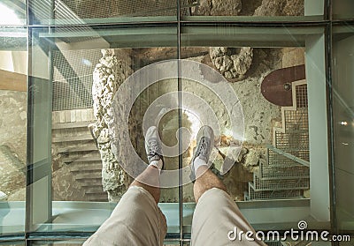 Glass floor of Punic Wall Interpretation Center. Visitor view under his feet Editorial Stock Photo