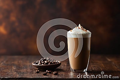 glass of frappe coffee with whipped cream topping on table Stock Photo