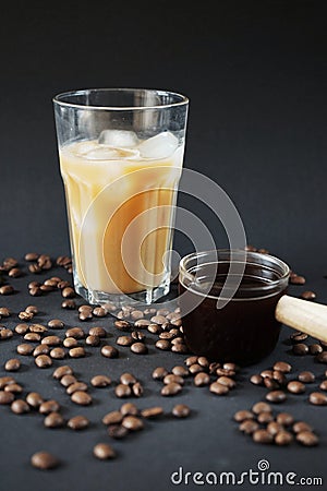 Glass of Frappuccino with ice and glass coffee scoop Stock Photo