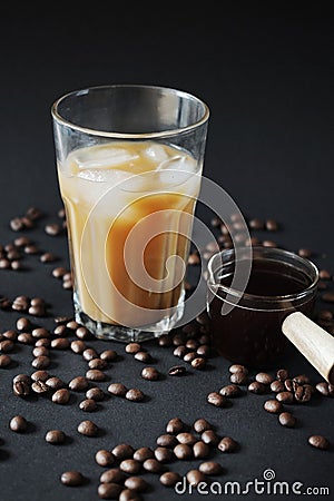 Glass of Frappuccino with ice and glass coffee scoop Stock Photo