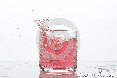 A glass of fresh drink with splashes on white Stock Photo