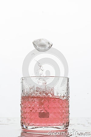 A glass of fresh drink with splashes on white Stock Photo