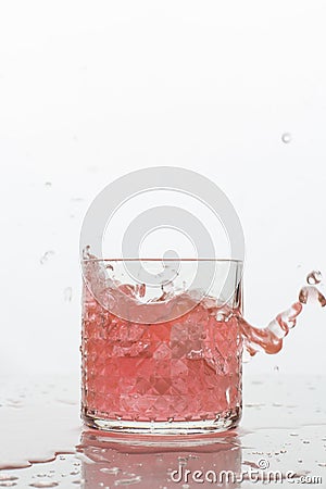 A glass of fresh drink with splashes on white Stock Photo