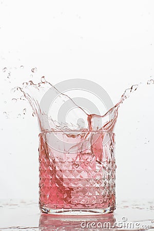 A glass of fresh drink with splashes on white Stock Photo