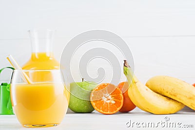 A glass of fresh orange juice and fruits Stock Photo