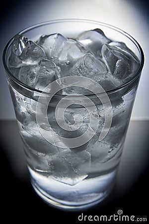 Glass full of ice and water Stock Photo