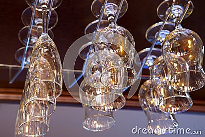 Glass glasses above the bar rack Stock Photo