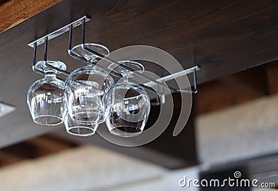 Glass goblets in interior wood alcoholic bar Stock Photo