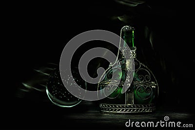 Glass green bottle with magic potion Stock Photo