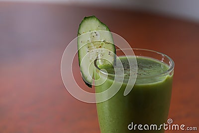 A glass of green fruit and vegetable smoothies Stock Photo