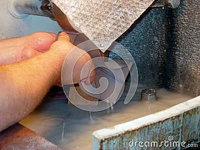 Glass grinding in handicraft business Stock Photo