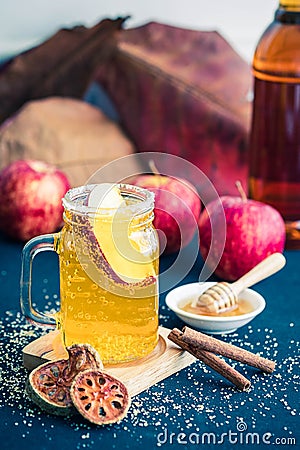 Glass of healthy bael tea with cinnamon, appel and honey Stock Photo