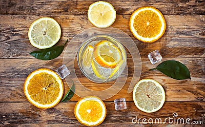 Glass homemade lemonade, orange, lemon, ice cube Stock Photo