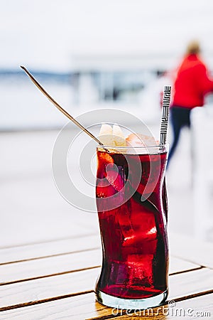 Glass of homemade sangria cocktail with fruits and ice cubes Stock Photo