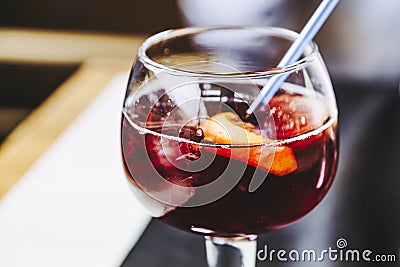 Glass of homemade sangria cocktail with fruits and ice cubes Stock Photo