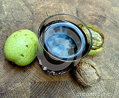 Glass of homemade walnut liqueur Stock Photo