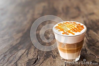 Glass of hot caramel macchiato coffee Stock Photo