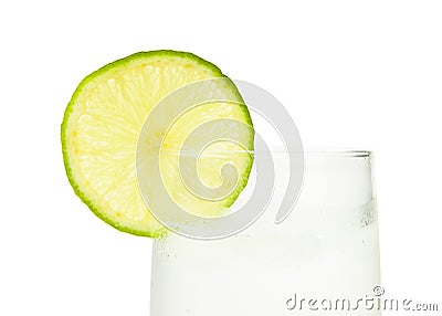 Glass of ice-cold water with slice of lime Stock Photo