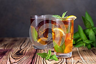 Glass of iced tea with mint and lemon. Cold drink. Rustic style Stock Photo