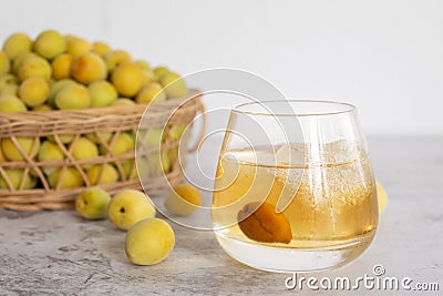 A glass of Japanese plum wine `Umeshu Stock Photo