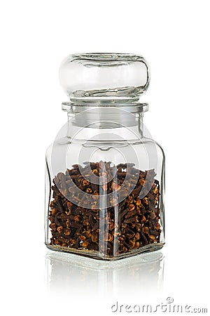 Glass jar with clove isolated Stock Photo