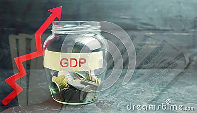 Glass jar with coins and the inscription ` GDP ` and up arrow. Business, economic, finance, salary, crisis. Economic growth concep Stock Photo