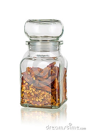 Glass jar with dried chili peppers clove isolated Stock Photo