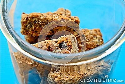 Glass jar filled with homemade rusks on a wooden surface Stock Photo