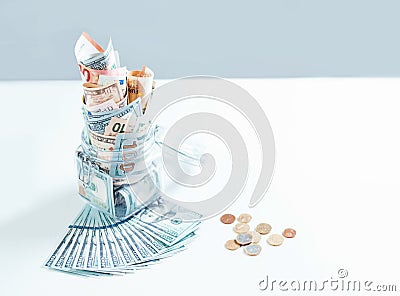 Glass jar full of money. Crisis Savings Concept Stock Photo